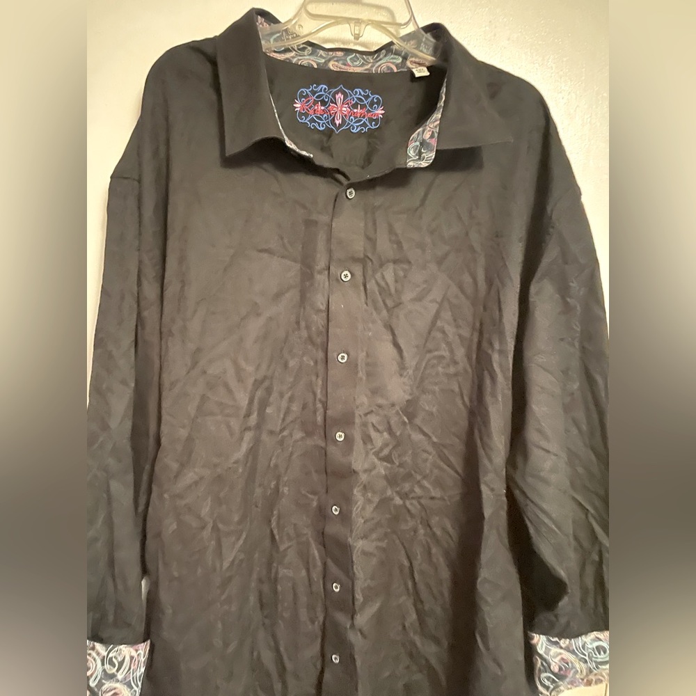 Long sleeve button down dress shirt with embellished cuffs.